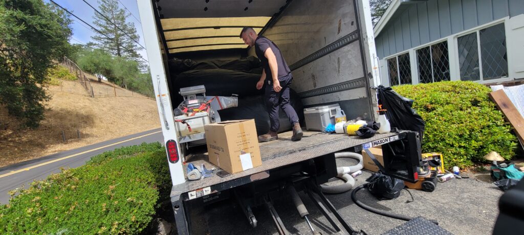 miller attics team leader checking equipment