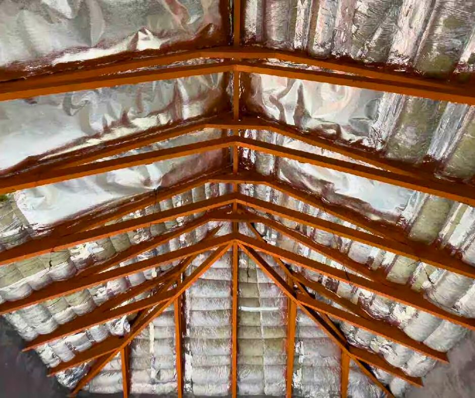 commercial roof insulation with radiant barrier and wooden beams