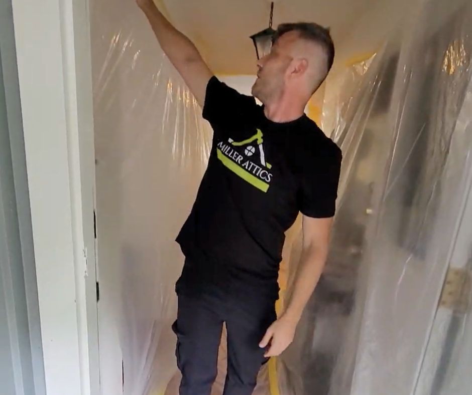 Alon from Miller Attics inspecting asbestos removal