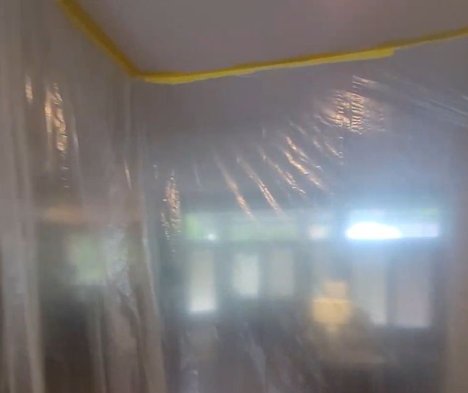 hallway covered with plastic sheet
